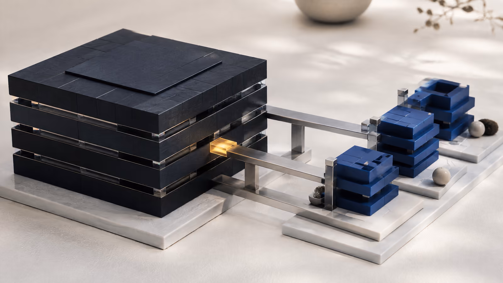 An intact navy structure linked by metal bridges to new blue modules; an amber connection marks the transition.